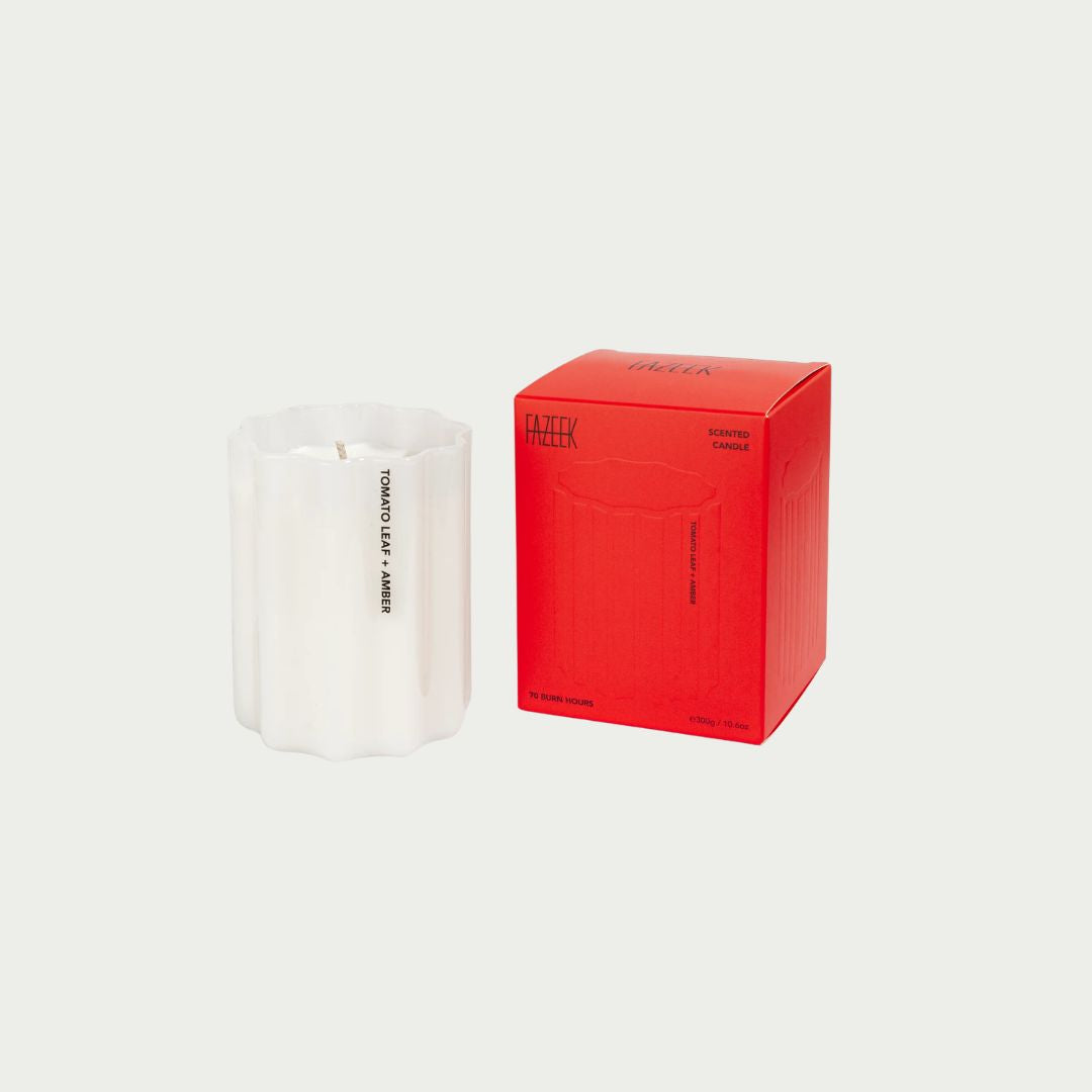 Fazeek Tomato Leaf + Amber Scented Candle 300g in a white fluted vessel, with up to 70 hours of burn time. Shop it in-store and online at Good Huis Co.