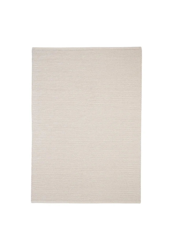 The Bay Rug, a handwoven indoor outdoor polypropylene rug with braided linear texture