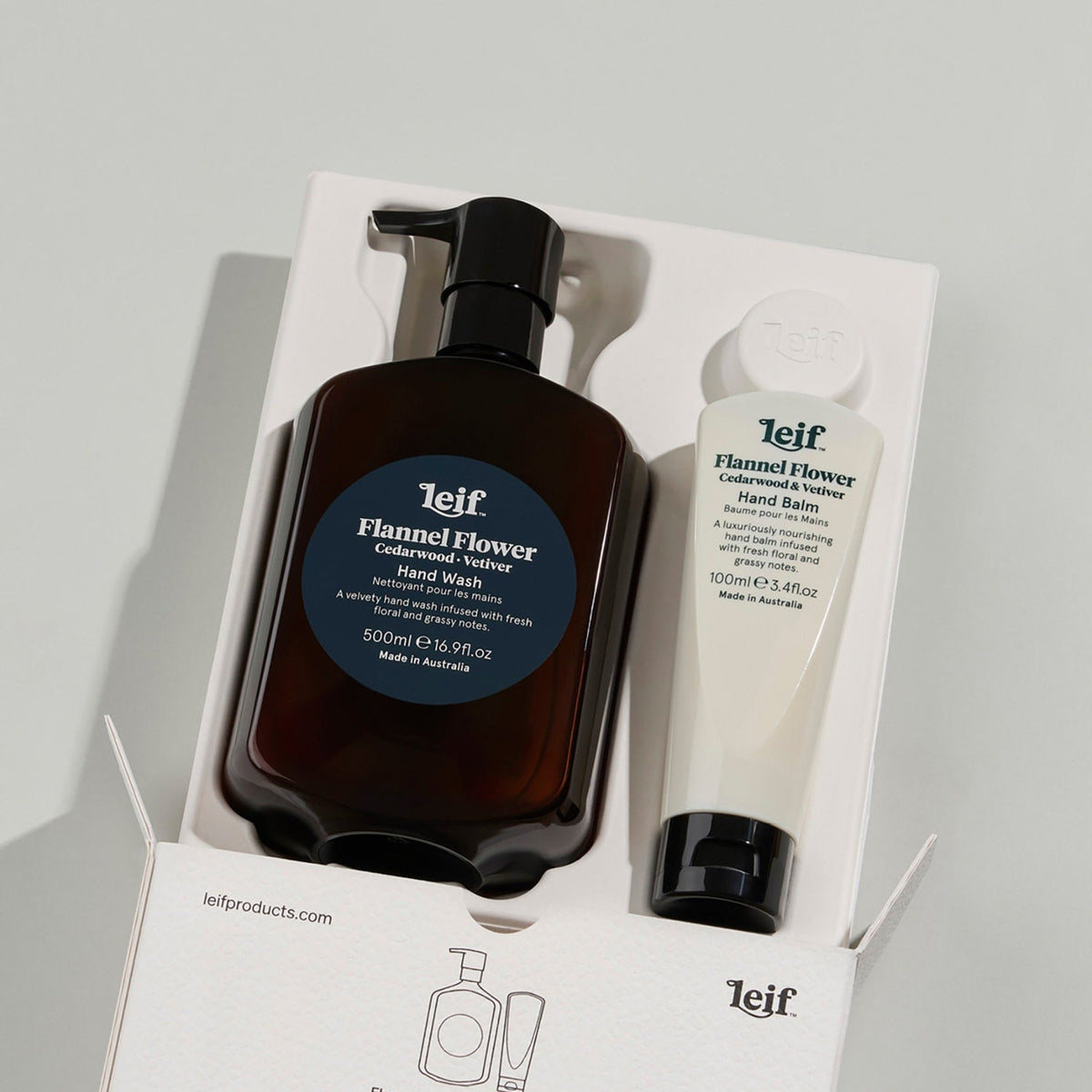 Leif Flannel Flower hand wash and balm set on a gray background