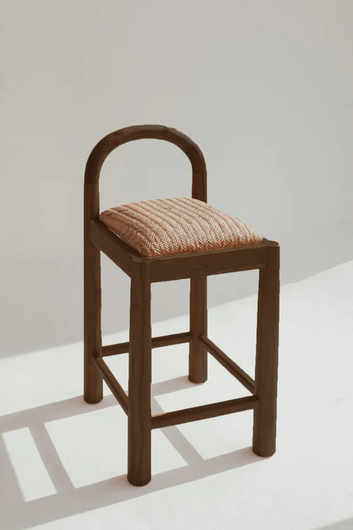 Desa Bar Stool in Chocolate Brown teak, arched backrest with hand-woven Desa pattern seat.