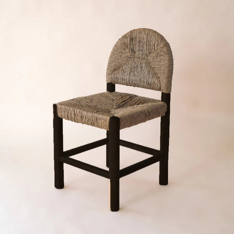 Dilly Dining Chair in Black teak frame with woven synthetic rattan seat and backrest.