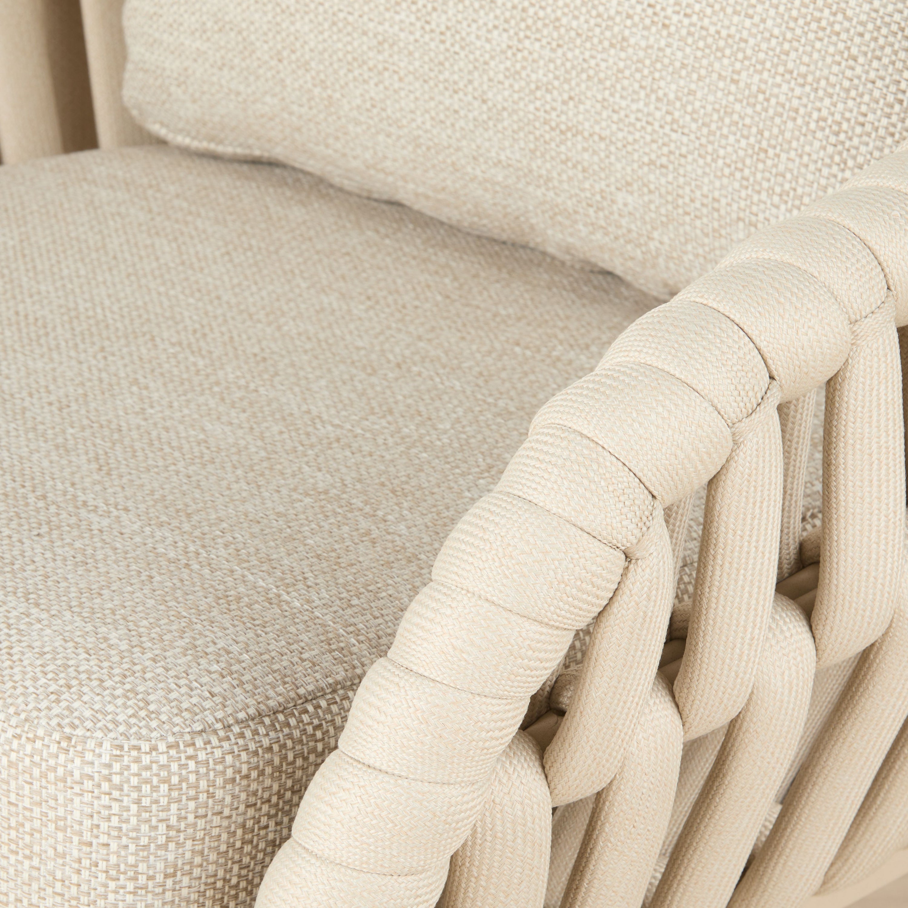 Elwood Outdoor Chair in Beige, woven polyester rope frame with cushioned seat, styled on a white background.