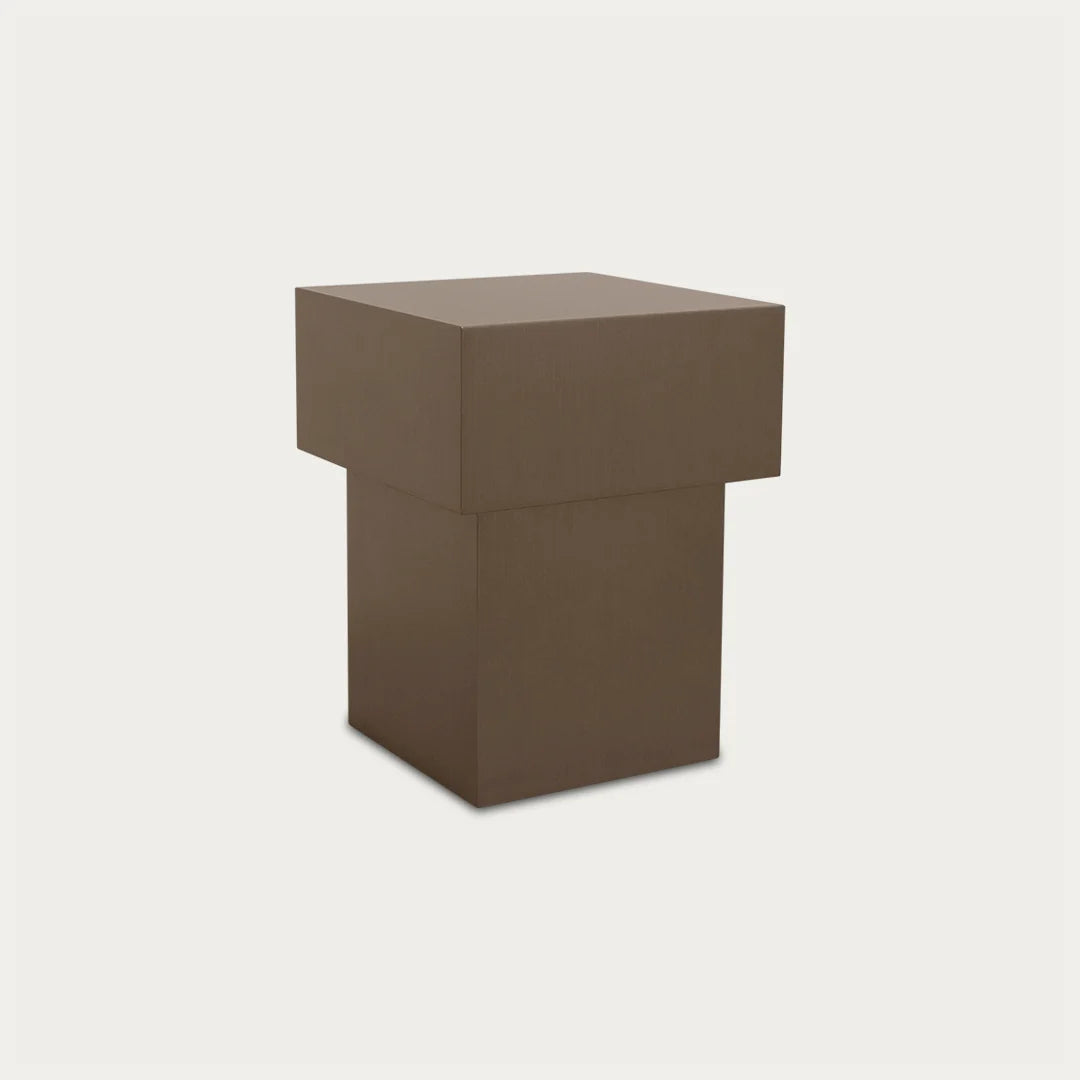 Sculptural plinth-form side table in brushed metal finish