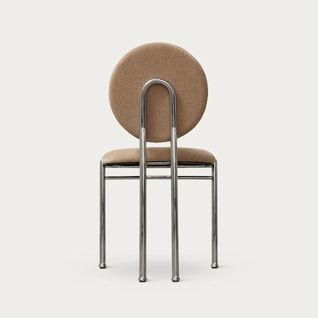 Dining chair with circular ecru upholstered backrest and steel legs