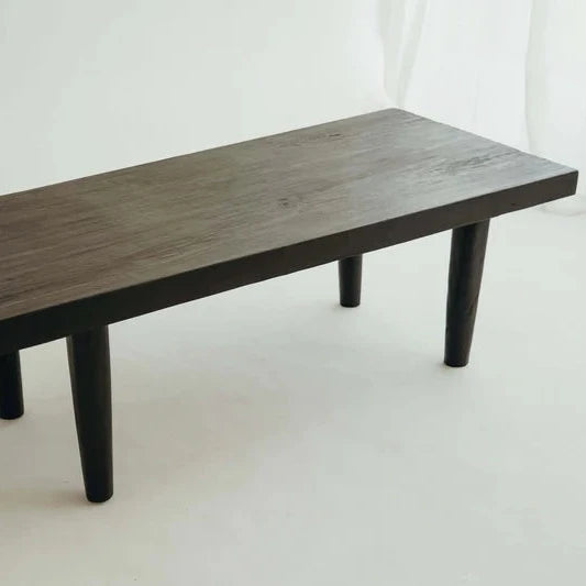 Hugo Coffee Table in Walnut, rectangular timber top on tapered legs, shown on a white background.