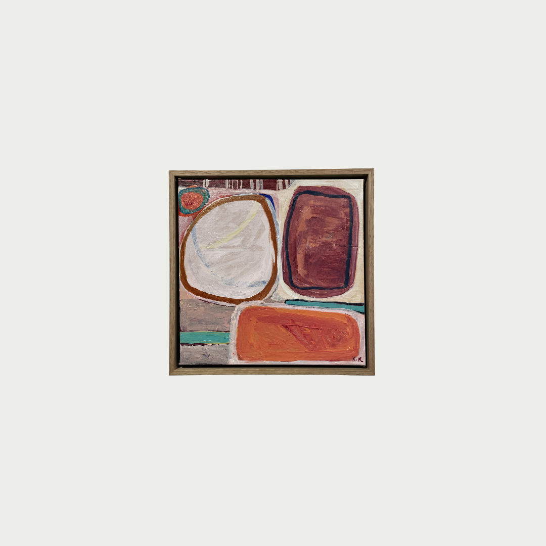 An abstract framed painting featuring organic shapes in cream, terracotta, rust, and brown tones, centered on a light gray background.