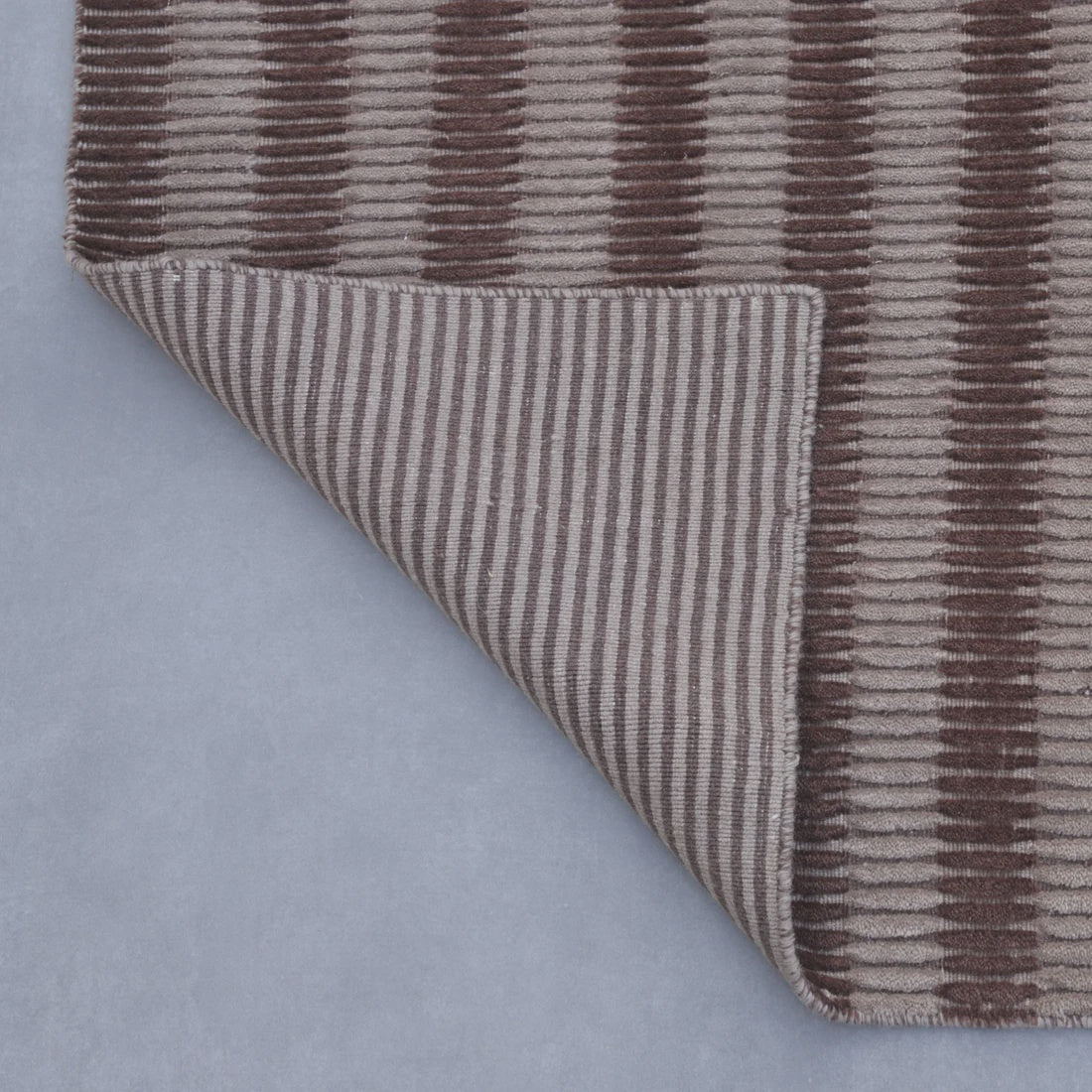 Clay Linea wool rug in a muted earthed neutral — handloomed textural detail, Elan & Earth at Good Huis Co Geelong