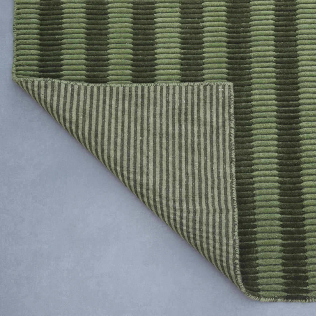 Olive Linea wool rug in a deep forest green — handloomed textural detail, Elan & Earth at Good Huis Co Geelong
