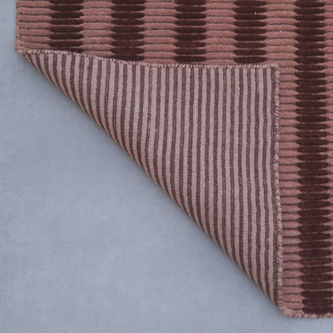 Terra Linea wool rug in a rich rusted red — handloomed textural detail, Elan & Earth at Good Huis Co Geelong