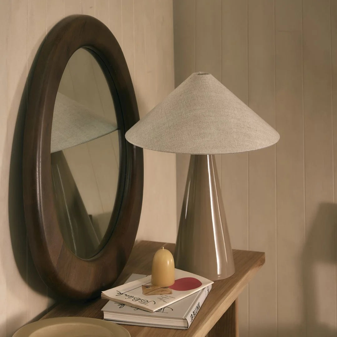 Round walnut timber wall mirror with organic asymmetric frame