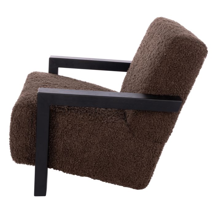 Brown textured armchair with black frame on a white background
