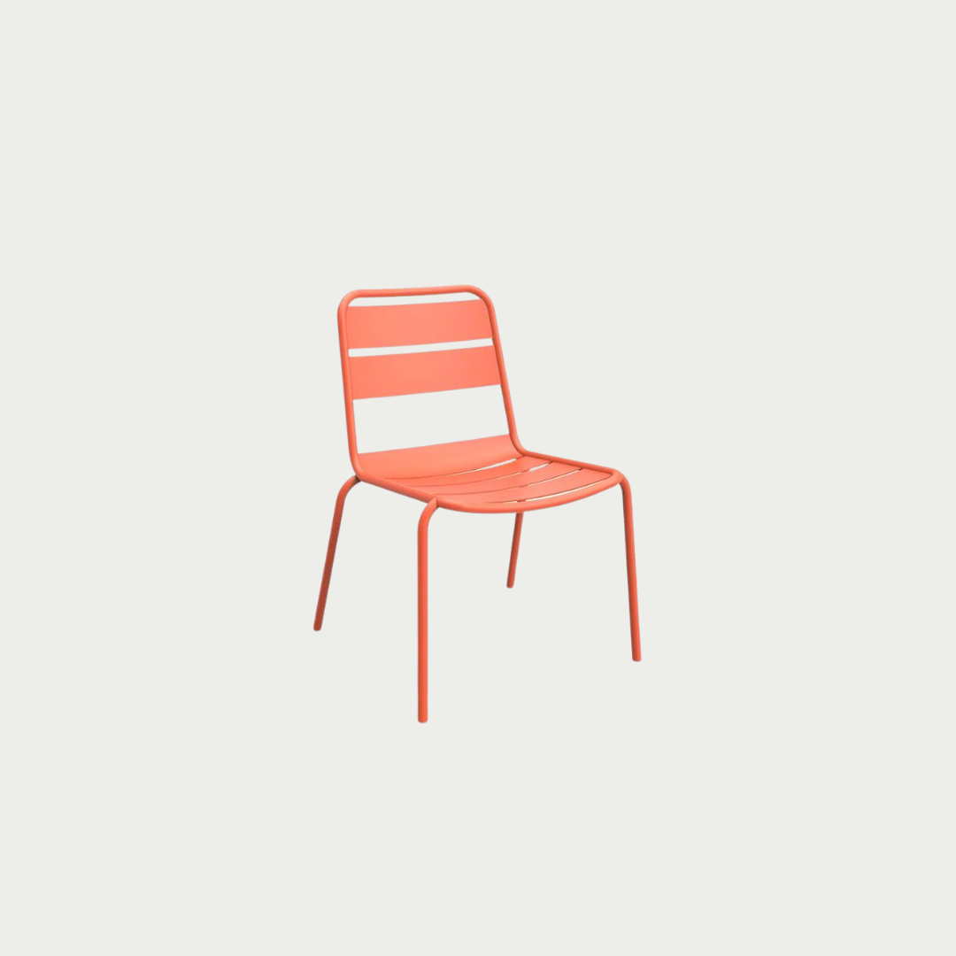 An orange metal Sprout Side Chair with a minimalistic design, suitable for outdoor use.