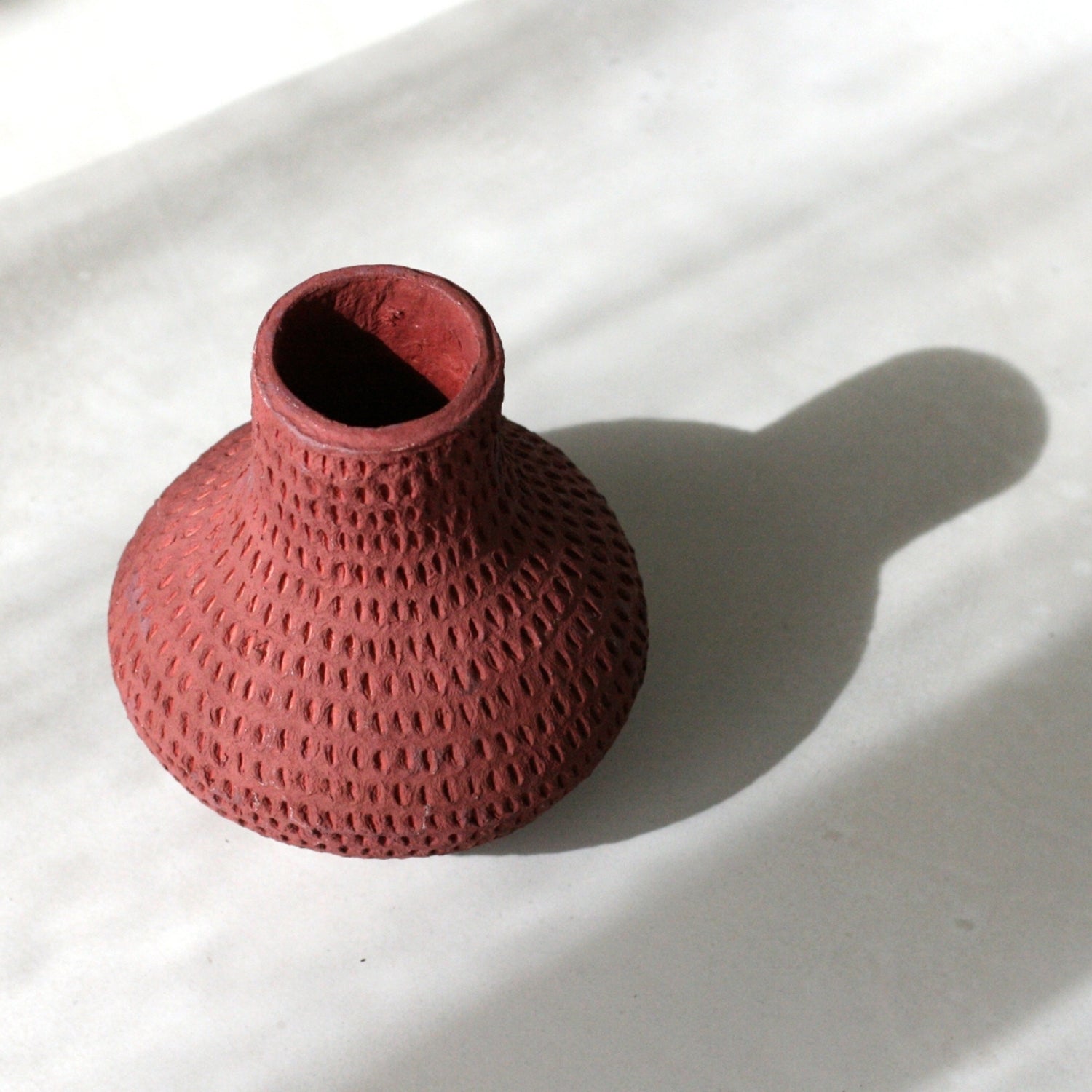Recycled Cotton Wide Vase, bulbous wide-bodied silhouette with a perforated textured surface, shown on a white background.