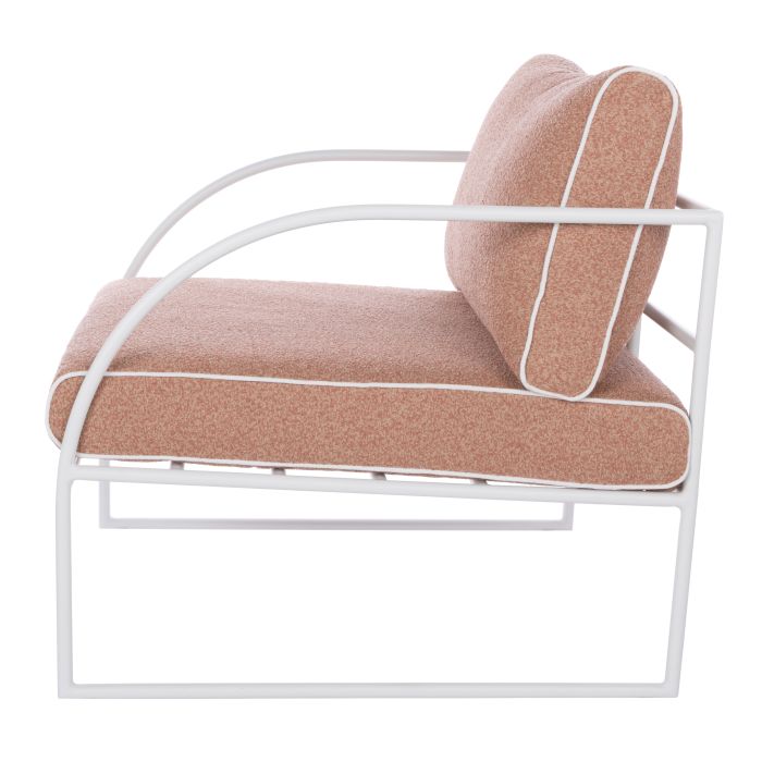 Reeve Outdoor Armchair in Coral Pink, white metal frame with plush cushions and white piping.