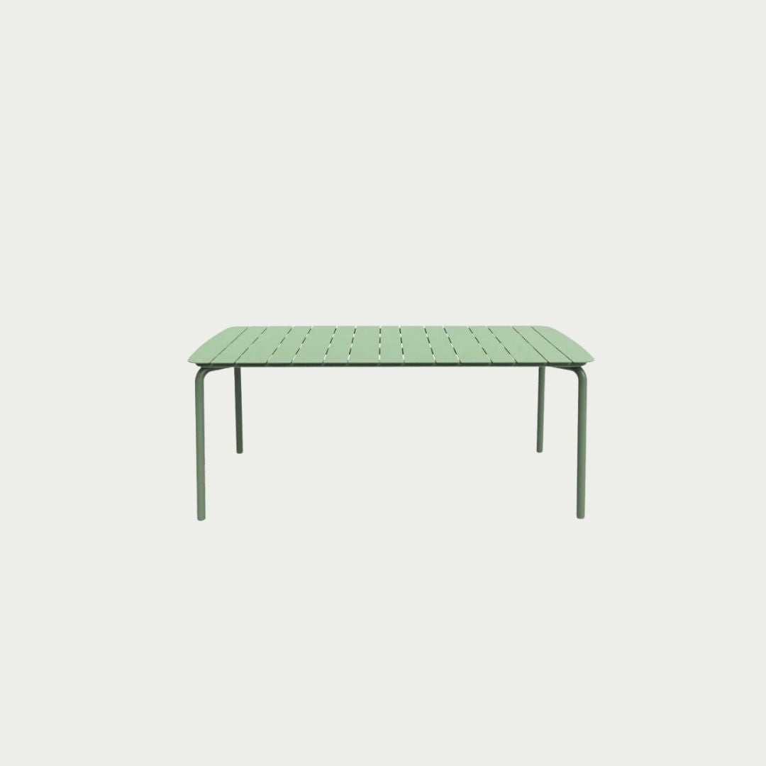 A rectangular green metal outdoor table with a textured finish and sleek design, suitable for patio or bar areas.
