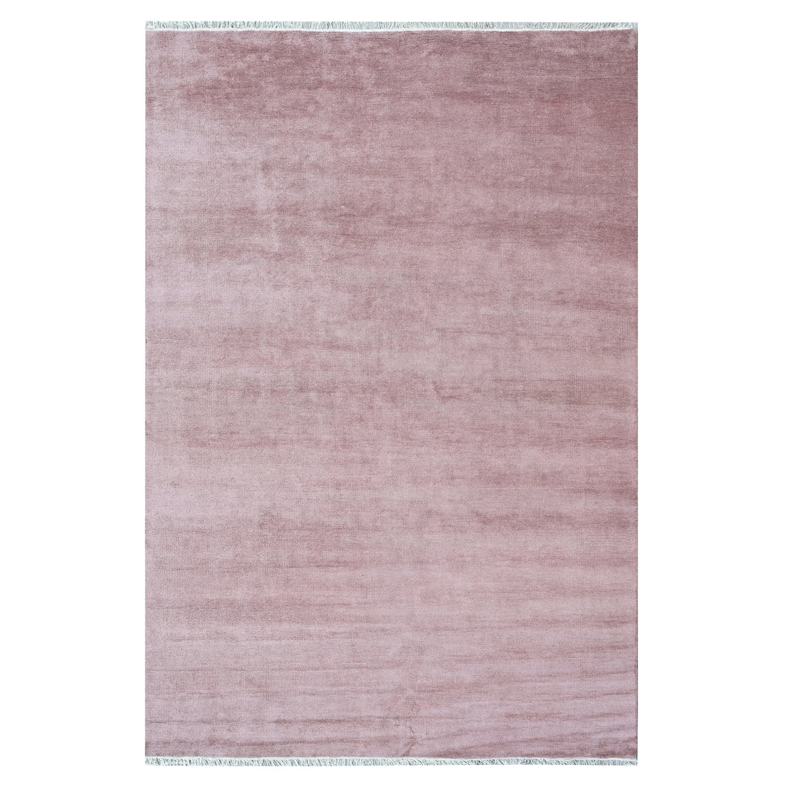 A rectangular area rug in a dusty rose pink color with subtle horizontal texture and light fringe on the top and bottom edges, shown against a plain white background.