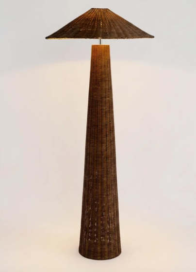 A tall floor lamp with a tapered conical base and matching shade, both made from dark brown woven natural fiber, shown against a plain light background.