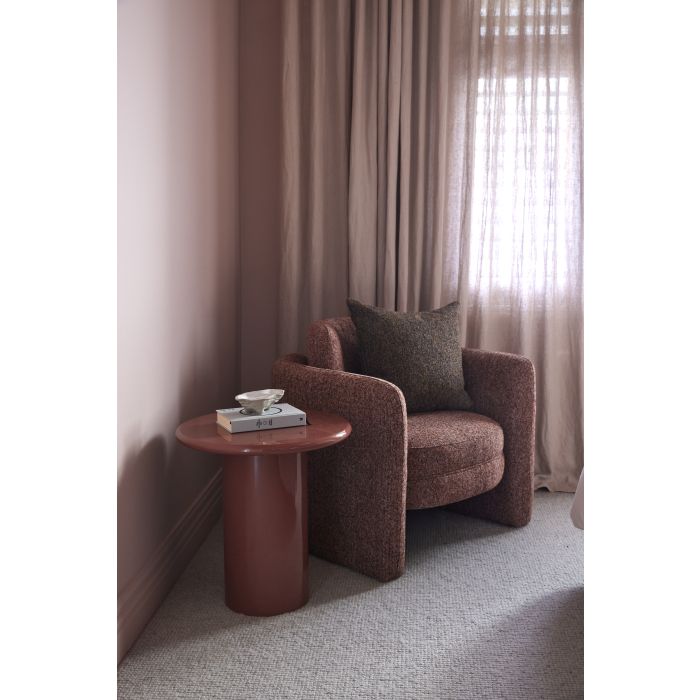 Wade Side Table in Hot Pink, round tabletop on a chunky cylindrical leg with a high-gloss finish, styled in a bedroom setting.