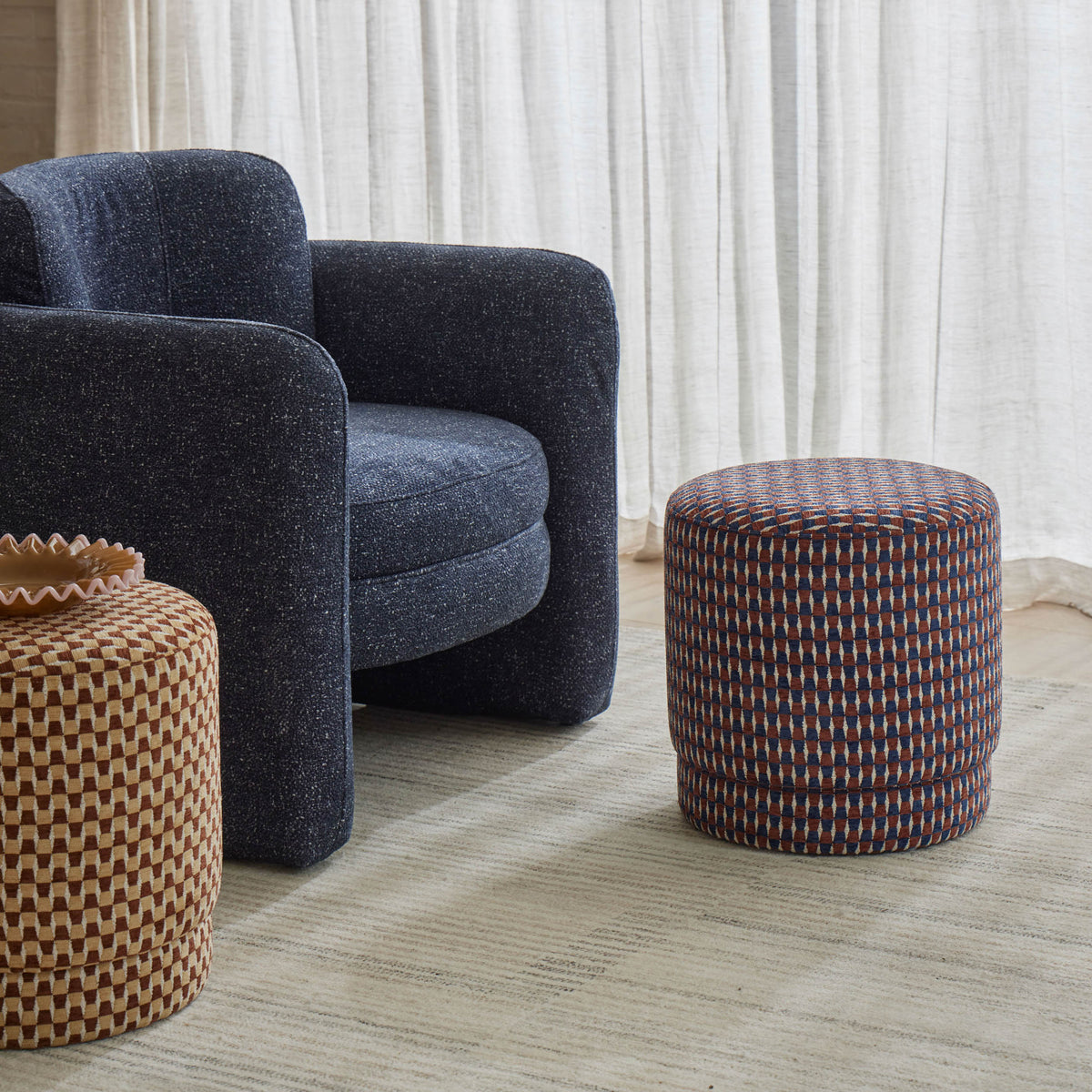 Walter Armchair in Navy, plush construction with a contemporary silhouette, styled in a living room setting.