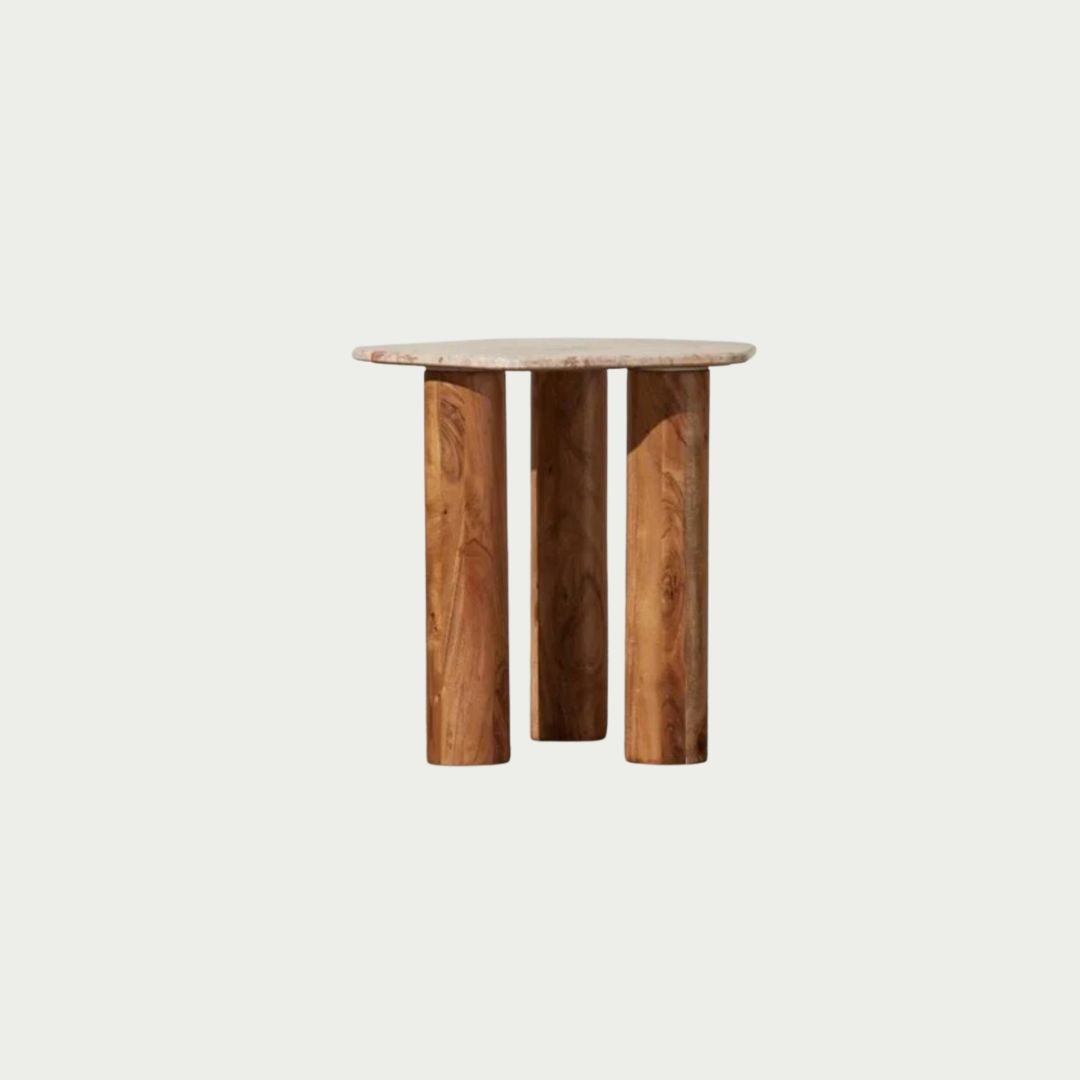Waverly Side Table in Pink Lagoon marble, irregular rounded top on three wooden column legs.