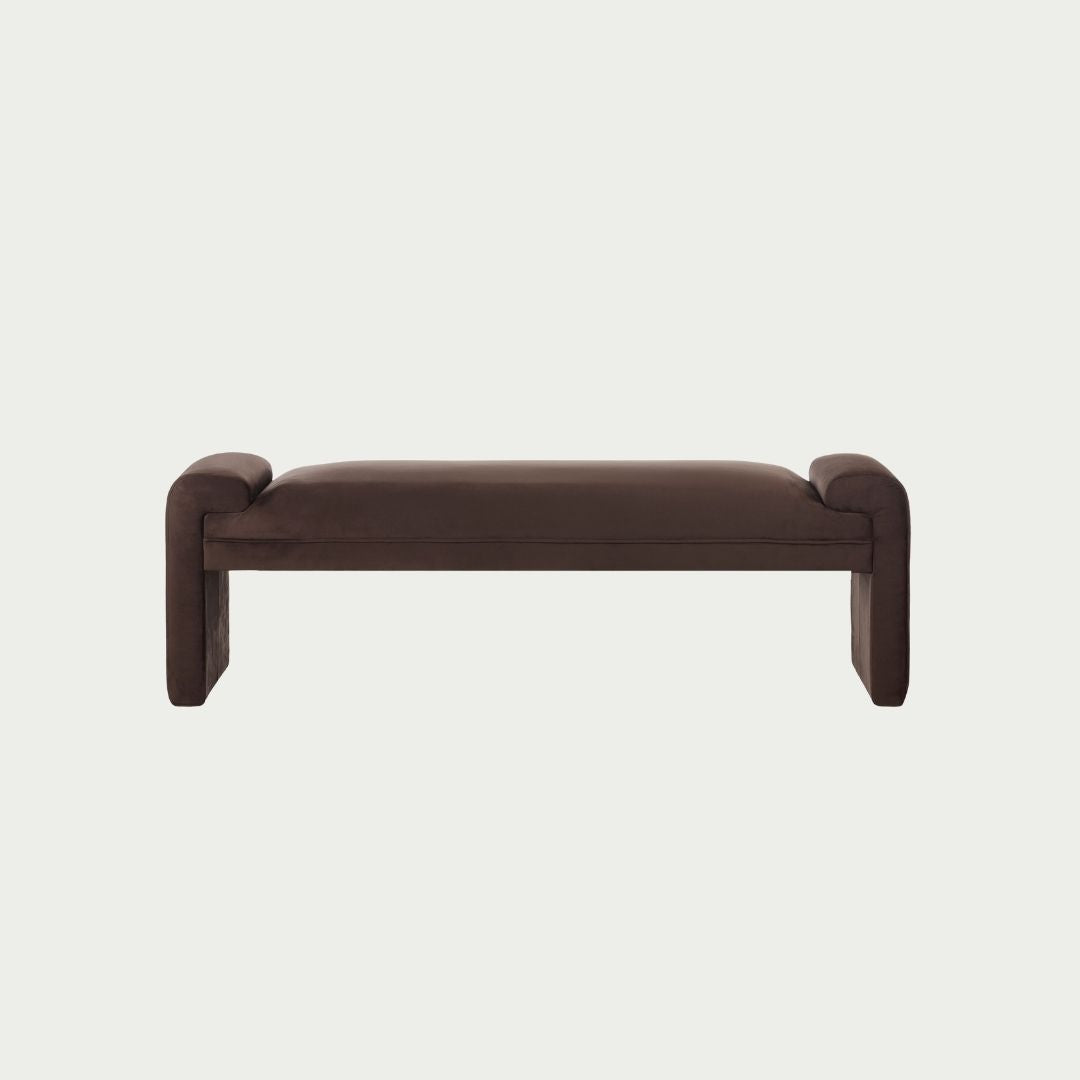 Zaha Bench Seat in Chocolate velvet, rounded arm ends and curved plywood legs, shown on a white background.