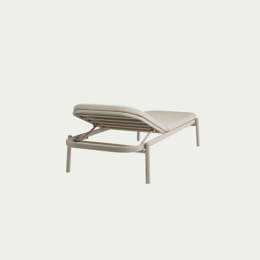 beige adjustableSun lounger with attached side table