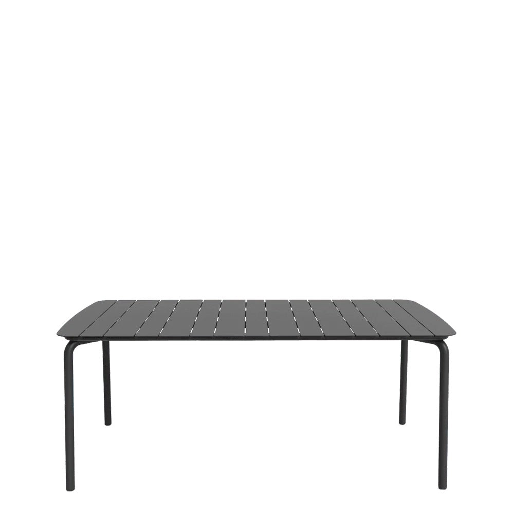A rectangular charcoal metal outdoor table with a textured finish and sleek design, suitable for patio or bar areas.