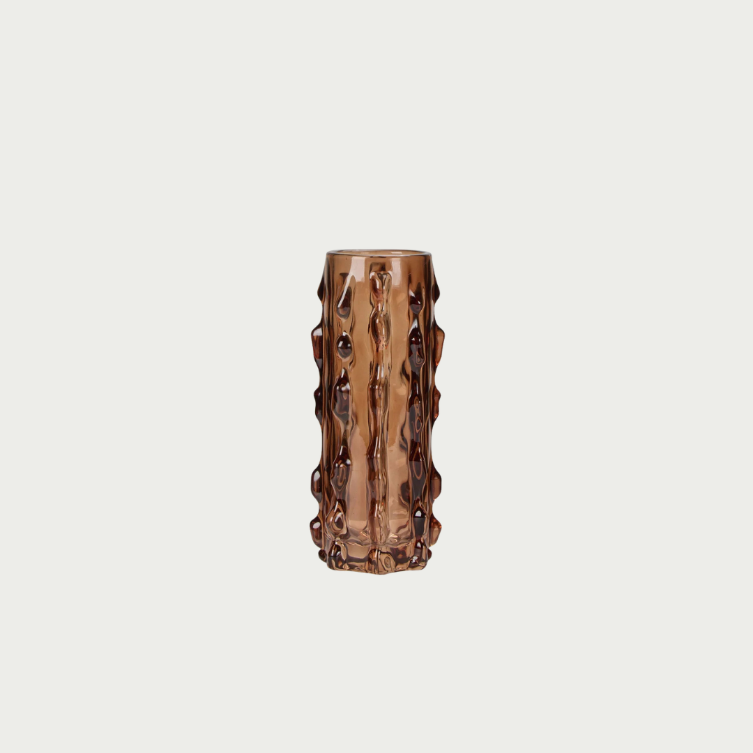 A textured, ribbed glass vase in a translucent amber-brown colour. 
