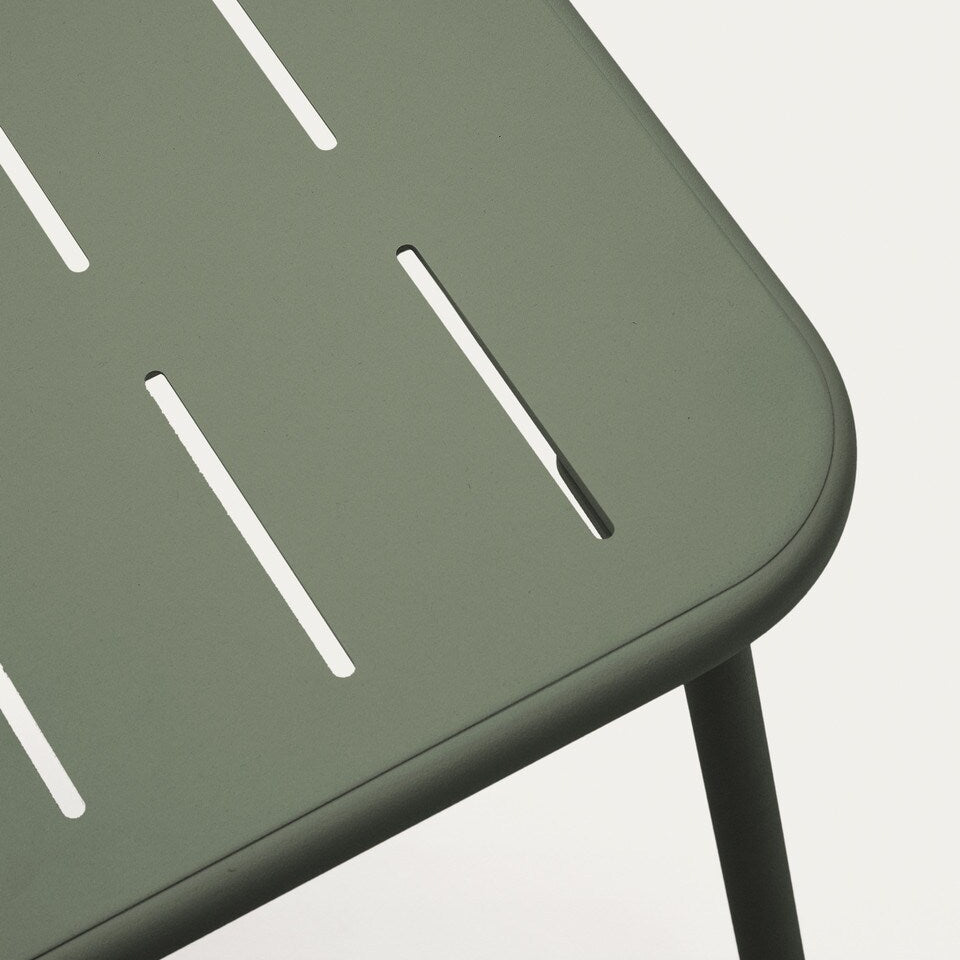 close up of green outdoor metal table