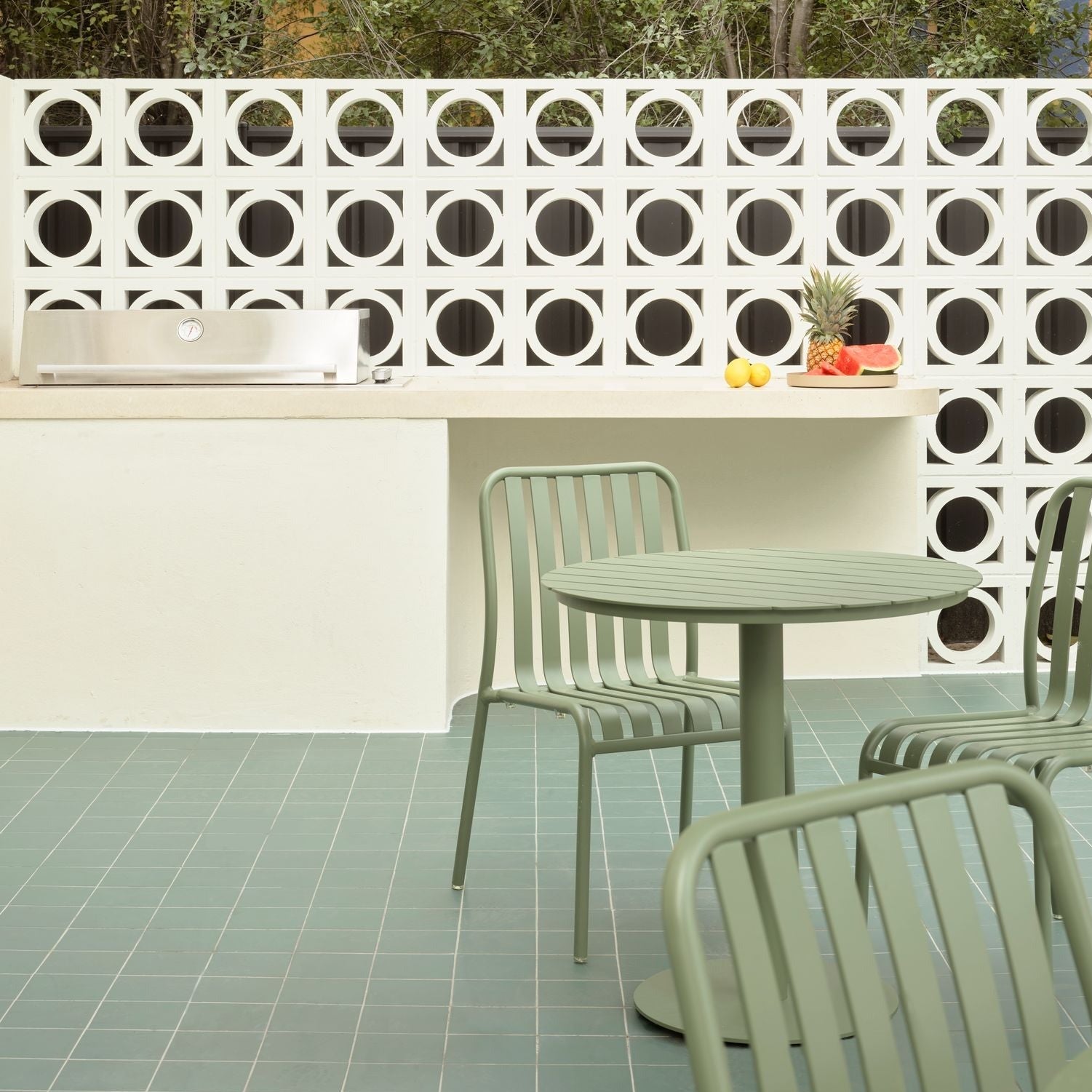 green outdoor table and chairs
