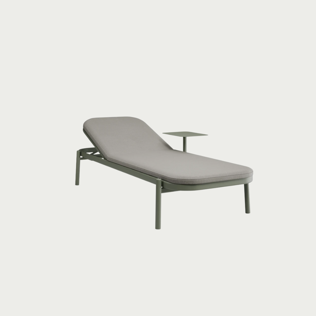 green sun lounger with side table