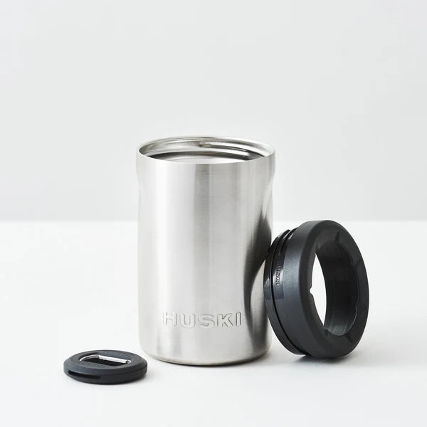 Stainless steel tumbler with black lid on a white background