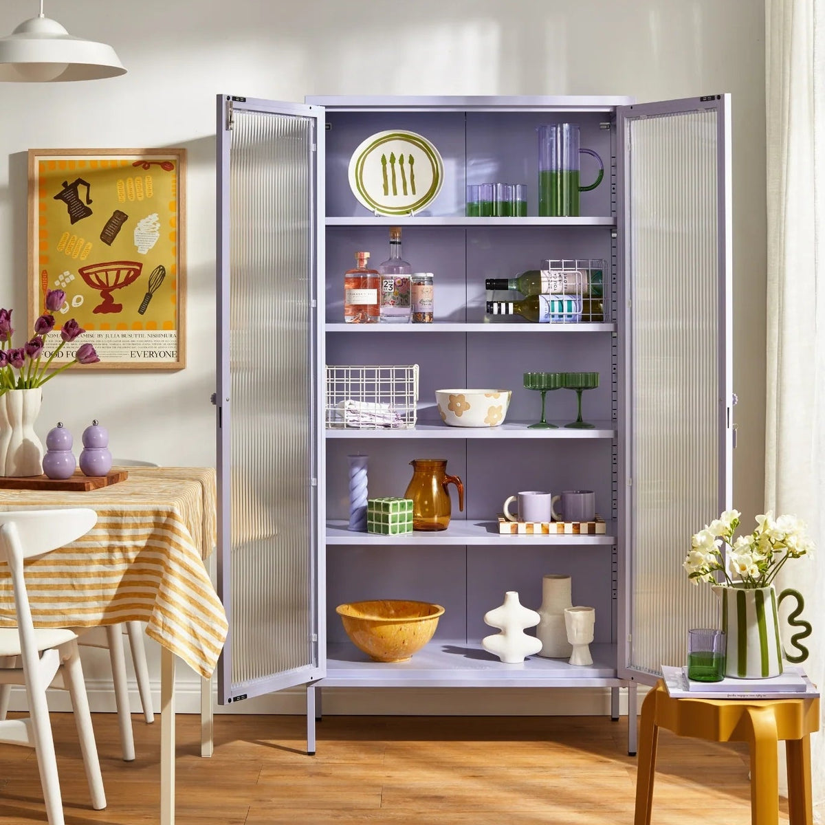 A tall lavender-gray pantry cabinet with open doors and five shelves, styled with kitchenware and dishes in a bright dining room.