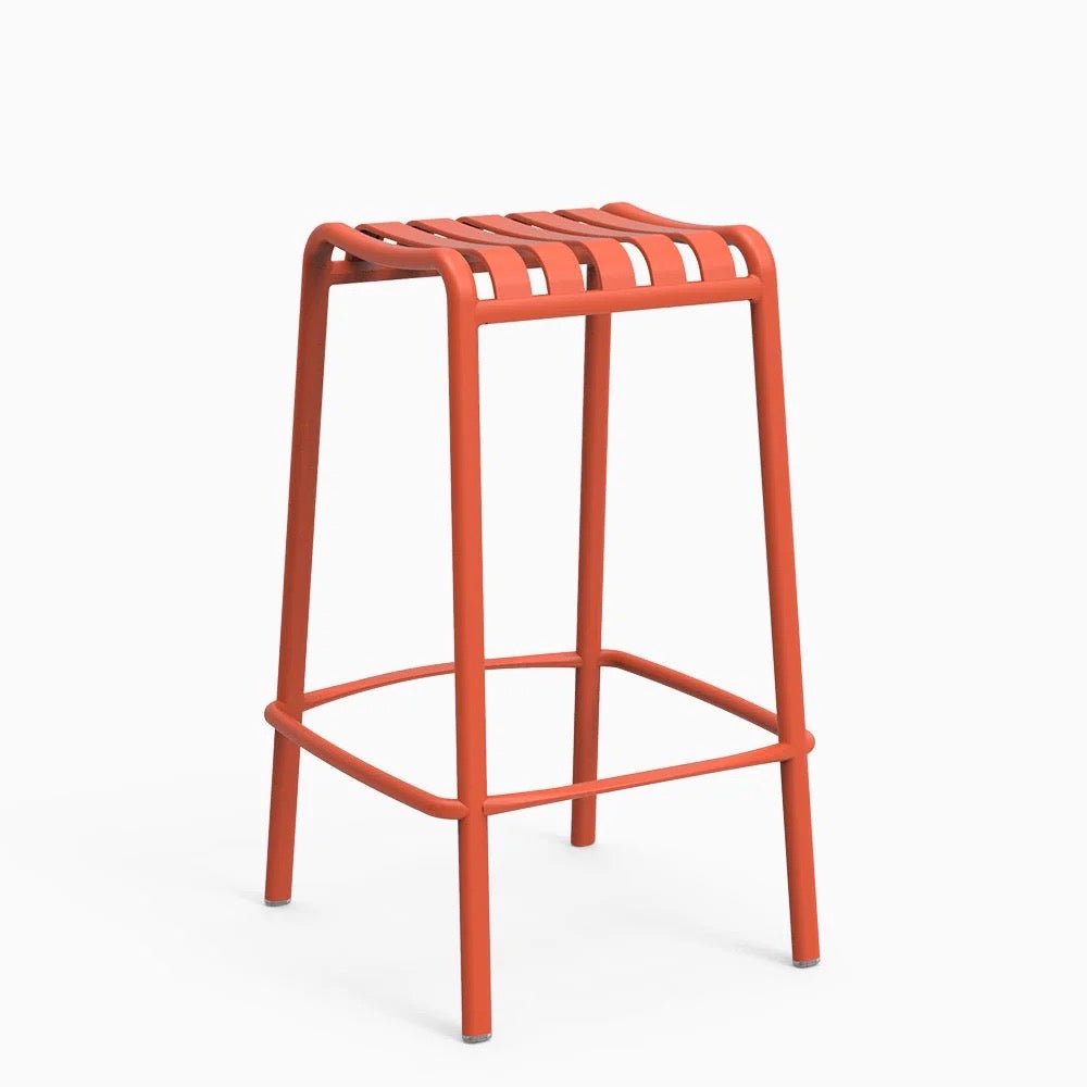 A orange backless stool with a lightweight aluminum frame and a natural textured finish.