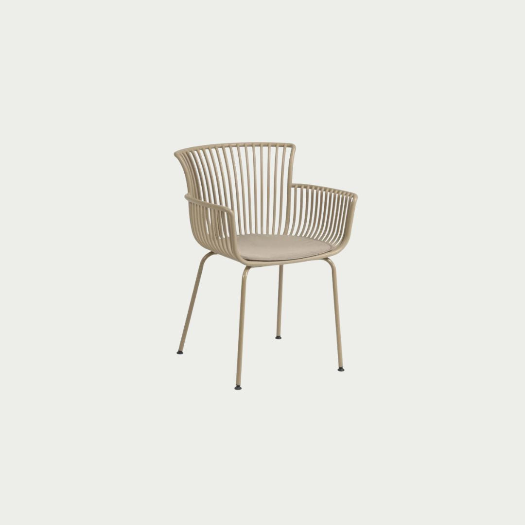 A beige Surpika Alfresco chair with a hard wearing polypropylene structure, moulded arms, and powder coated steel legs.
