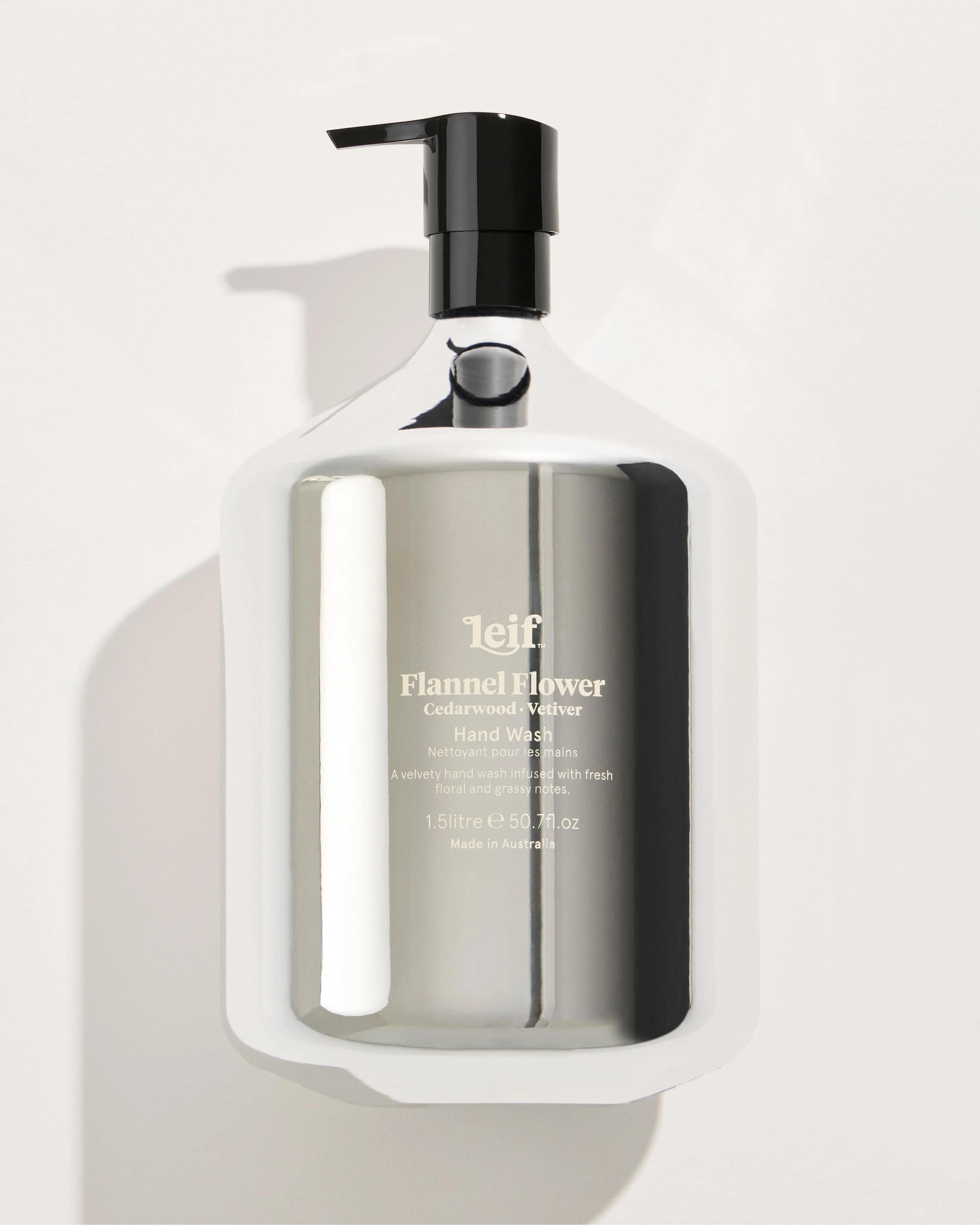 Hand wash bottle with pump on a light gray background