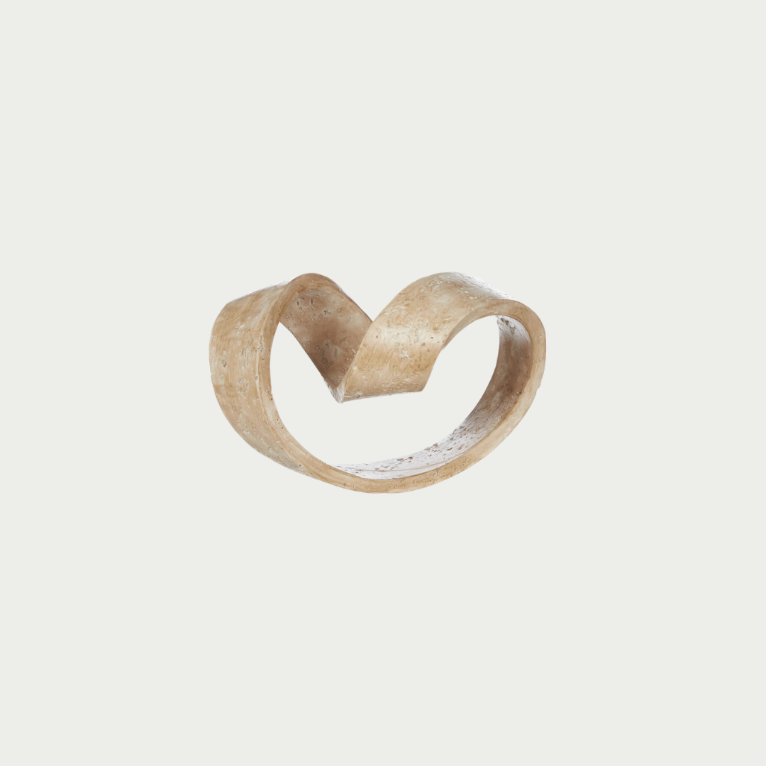 A sculptural, open heart-shaped ring made of textured natural bone or horn. 
